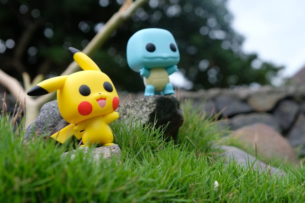 yellow-and-white-duck-plush-toy-on-green-grass-during-daytime-dypo-xgae4y